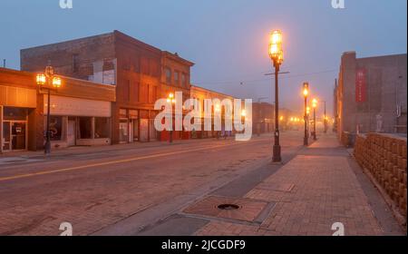Duluth, Minnesota, USA – May 30, 2022:  Illuminated downtown street in the early morning fog Stock Photo