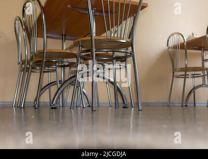 school kitchen canteen, metal table and chair legs, canteen equipment, catering establishment, tables and chairs Stock Photo