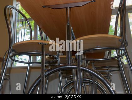 school kitchen canteen, metal table and chair legs, canteen equipment, catering establishment, tables and chairs Stock Photo