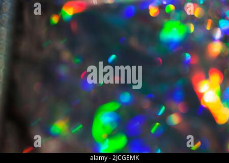 Rainbow holographic bokeh background. Multicolored overflows of color. Stock Photo