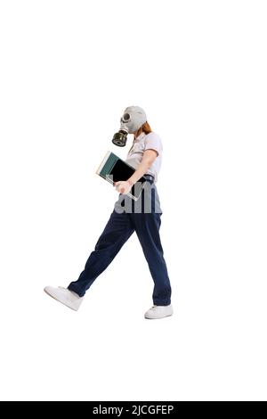 Portrait of young employee, office worker wearing gas mask isolated over white studio background. Informational security. Stock Photo