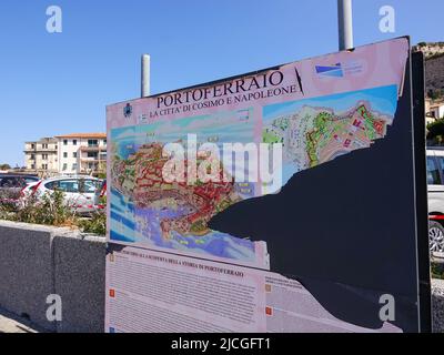 Torn sign at the city port announcing Portoferraio as the city of Cosimo (di Medici) and Napoleon (Bonaparte), Island of Elba, Tuscany, Italy. Stock Photo