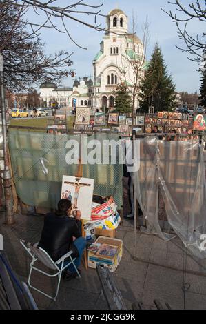 Sofia, Bulgaria. 7th Mar, 2019. An artist paints a religious image outside Alexander Nevsky Cathedral, Sofia. (Credit Image: © John Wreford/SOPA Images via ZUMA Press Wire) Stock Photo