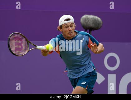 Queen's Club, West Kensington, London, England; 13th June 2022; Cinch Queens Club ATP Tour 500 series Lawn Tennis tournament; Alex De Minaur (AUS) plays a forehand against Reilly Opelka (USA) Stock Photo
