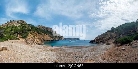 Cala d’Egos sandy beach and surrounding cliffs, hidden gem of Mallorca, panoramic view on the tourist destination for hikers, best of the Balearic isl Stock Photo