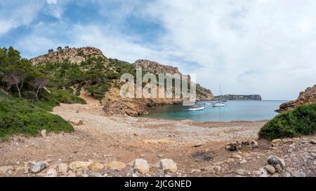 Cala d’Egos sandy beach and surrounding cliffs, hidden gem of Mallorca, panoramic view on the tourist destination for hikers, best of the Balearic isl Stock Photo