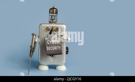 The robot holds a shield with the inscription cybersecurity. Stock Photo