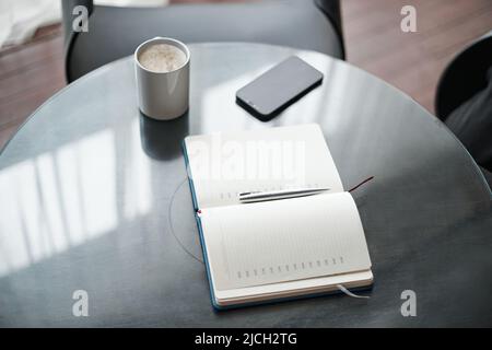 open notebook on the coffee table. close-up. Stock Photo