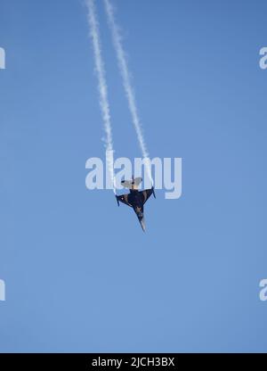 BAKU, Azerbaijan - MAY 28, 2022: Turkish Air Force Solo Aerobatics Display Team Solo Turk performs. Solo Turk airplane is a F-16 C Stock Photo