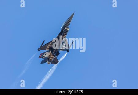 BAKU, Azerbaijan - MAY 28, 2022: Turkish Air Force Solo Aerobatics Display Team Solo Turk performs. Solo Turk airplane is a F-16 C Stock Photo