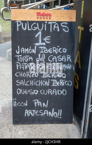A blackboard menu outside a Spanish restaurant selling Spanish food and drink in Caceres Sopain Stock Photo