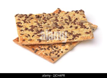 Whole grain crispbread with various seeds isolated on white Stock Photo
