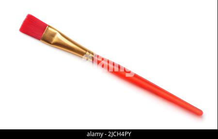 Top view of red plastic paintbrush isolated on white Stock Photo