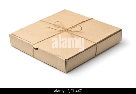 Blank brown cardboard pizza box tied with jute twine isolated on white Stock Photo