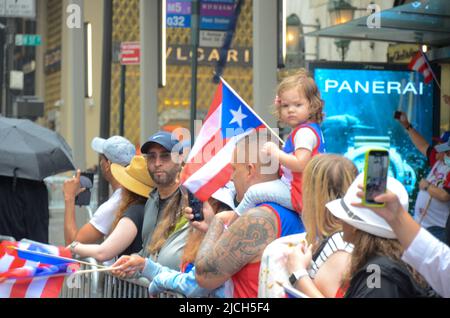 Spectators gathered in Mid-Manhattan to celebrate the 65th annual Puerto Rican Day Parade on June 12, 2022 in New York City. (Photo by Ryan Rahman/Pacific Press/Sipa USA) Stock Photo