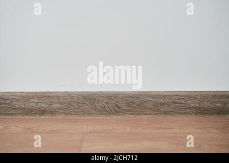 Floor with white wall and skirting board  Stock Photo