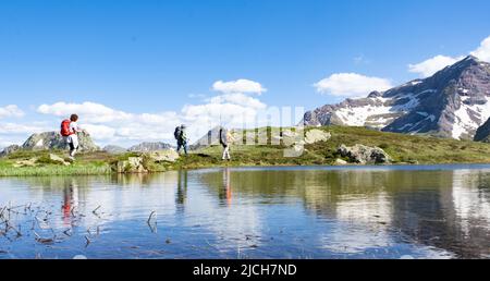 Hikers on the path between Portalet and Ibones de Anayet, Pyrenees of Huesca Stock Photo
