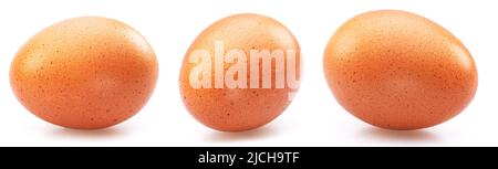 Three brown chicken eggs isolated on white background. Stock Photo