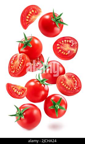 Falling cherry tomatoes and tomato slices isolated on white background. Macro shot. File contains clipping paths for each item. Stock Photo
