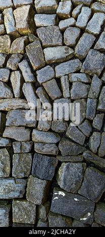 Textured, small pebbles from the sea from the island of Terceira May 2022 Stock Photo