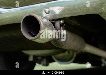 Car exhaust pipe. Old car muffler, close up Stock Photo