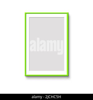 Vertical, bright green pas partu frame on a white wall. Mockup of poster frames. Art show. Stock Photo