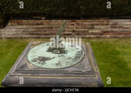 A Historic Victorian sundial. An ancient method of telling the time by using the shadow cast upright central spike. Stock Photo