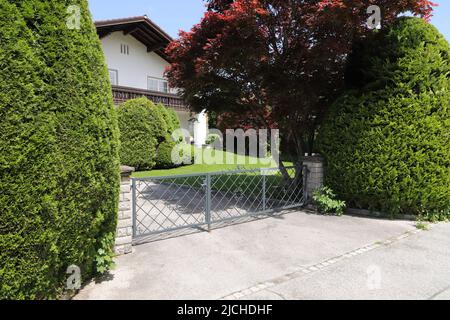 a new house with a driveway gate Stock Photo