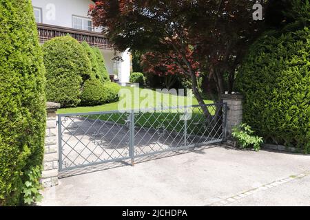 a new house with a driveway gate Stock Photo