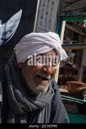 Hurghada, Egypt - February 21, 2022: Happy old arab man portrait Stock Photo