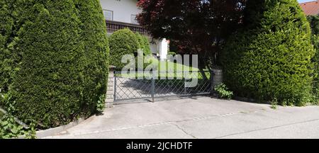 a new house with a driveway gate Stock Photo