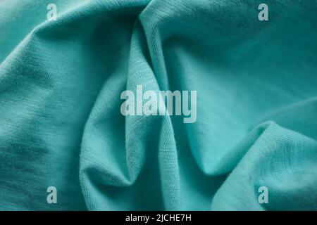 Wrinkled blue jersey, soft fabric background. Stock Photo