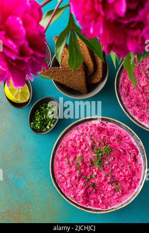 Cold soup svekolnik, Borscht or Chlodnik , soup made from boiled beets, potatoes and fresh vegetables Stock Photo