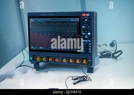 Digital oscilloscope. Eight-channel oscilloscope with built-in voltmeter. Stock Photo