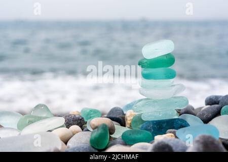 Natural polish textured sea glass and stones on the seashore