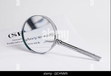 Abstract business research with finance documents and magnifying glass. High quality photo Stock Photo