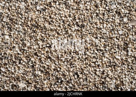 Beautiful small sea stone pebble background. Multicolored abstract beach nature pattern Stock Photo