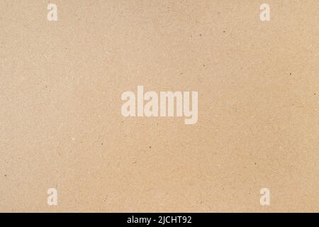 Smooth clean blank sheet of light brown cardboard as texture or background Stock Photo