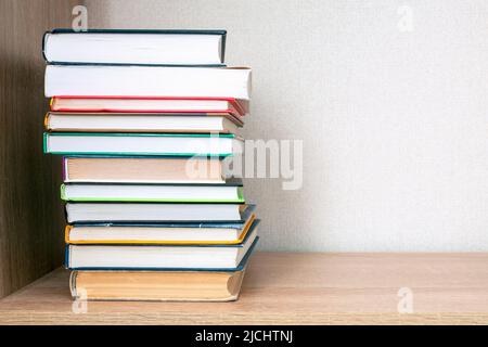 Stack of books on a bookshelf, concept education Stock Photo