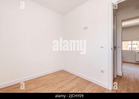 Empty renovated room with white walls and black door Stock Photo - Alamy