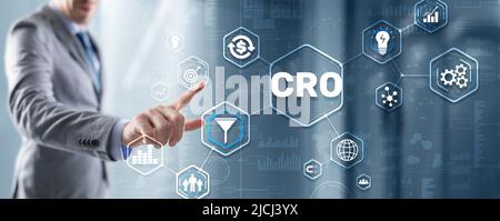 Conversion Rate Optimization. CRO Technology Finance concept Businessman pressing on a virtual screen Stock Photo