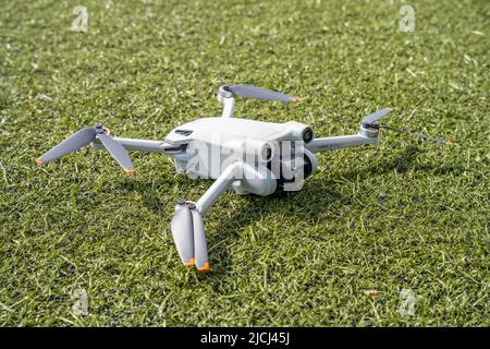 DJI Mini 3 Pro resting on the ground Stock Photo