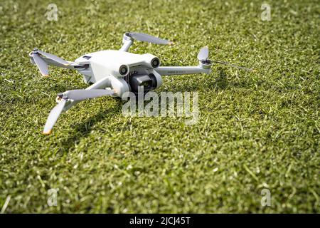 DJI Mini 3 Pro resting on the ground Stock Photo
