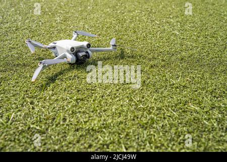 DJI Mini 3 Pro resting on the ground Stock Photo