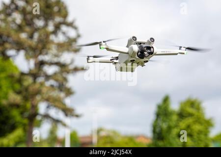 DJI Mini 3 Pro drone (UAV) hovering in flight Stock Photo