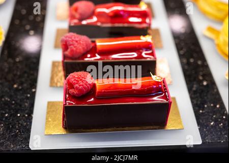 Austrian desserts, different types of chocolate and fruit cakes on display in cafe in Vienna. Stock Photo