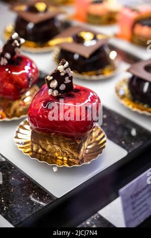 Austrian desserts, different types of chocolate and fruit cakes on display in cafe in Vienna. Stock Photo