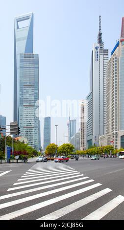 Shanghai, China - April 14, 2014: Street and pedestrian crossing in the Pudong New Area in Shanghai. Cityscape Stock Photo