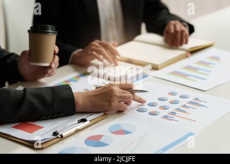Group of Businesswoman and Accountant checking data document on digital tablet for investigation of corruption account. Anti Bribery concept. Stock Photo
