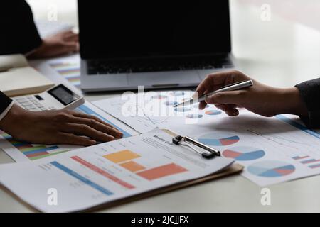 Group of Businesswoman and Accountant checking data document on digital tablet for investigation of corruption account. Anti Bribery concept. Stock Photo